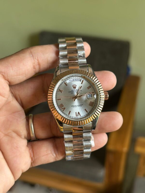 ROLEX ( OYSTER + SILVER COLOUR WATCH )